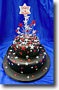 Wedding Cakes - 3 tier Scolloped Oval on pillars, red