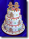 Wedding Cakes - Stacked round wedding cakes with sugar hearts and bride and groom icing models