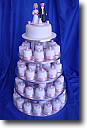 Wedding Cakes - 3 tier square wedding cake with icing flowers cascading down the front corners