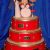 Wedding Cake with 3 tiers shaped like drums stacked together with Icing bride & groom models playing a icing drum kit cake topper